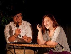 Students Jon and Megan emcee a film outreach