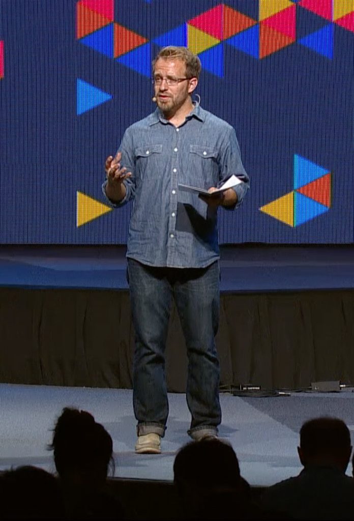 Lee emceeing a Cru conference.