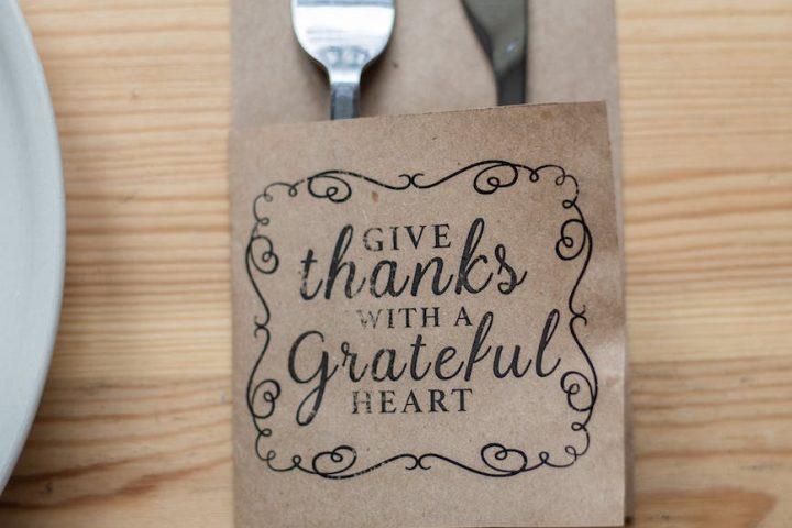 fork and knife in paper cover with inscription