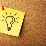 line drawing of a light bulb posted on a bulletin board