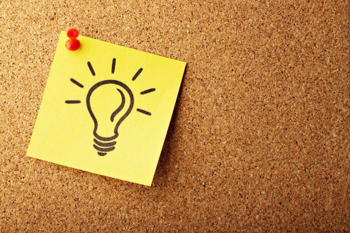 line drawing of a light bulb posted on a bulletin board